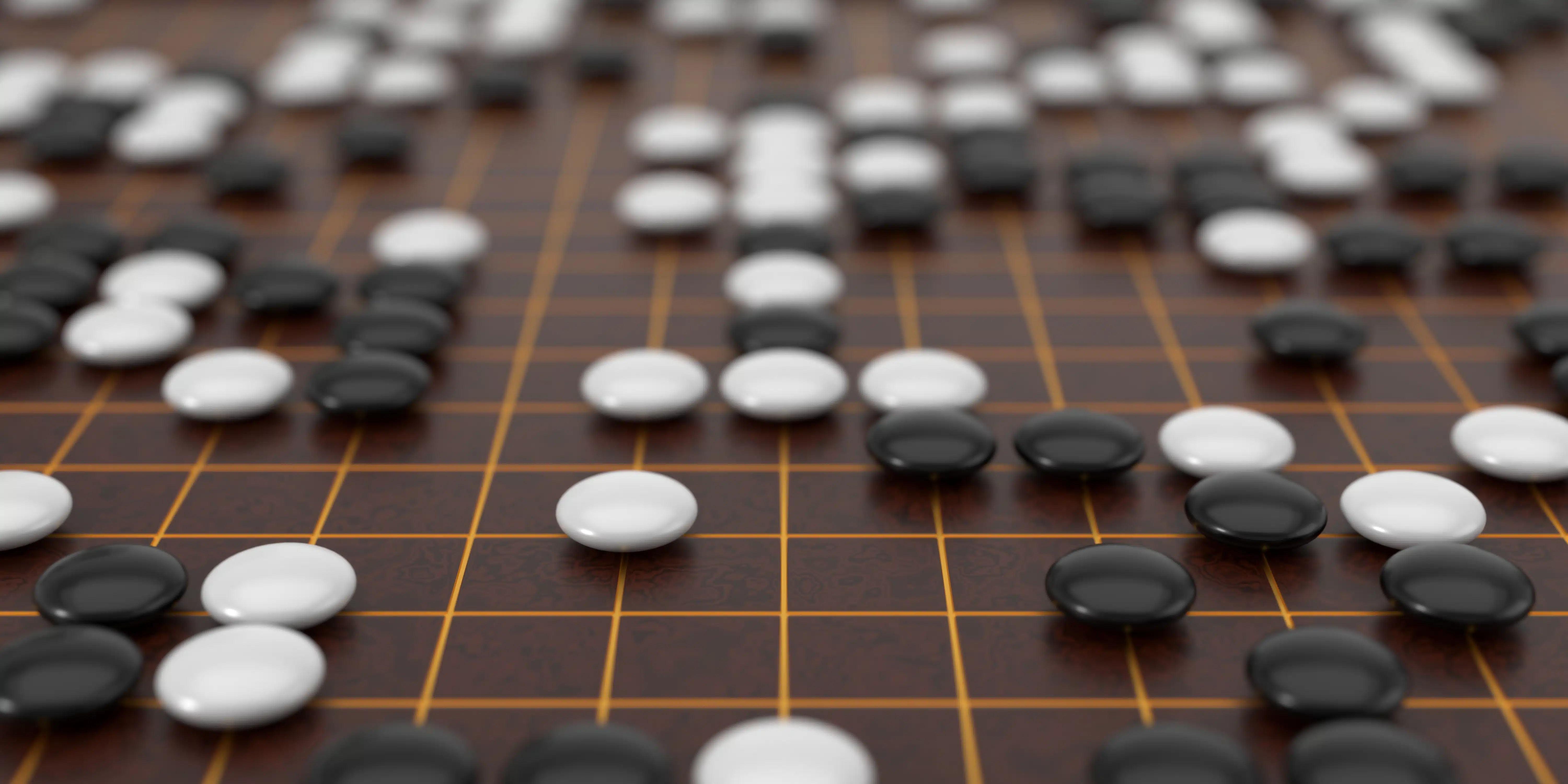 A close-up of a Go board with black and white stones placed on a wooden grid. The board shows a complex game state with strategic patterns emerging.